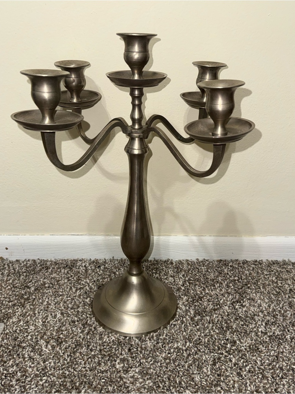 Silver color candle stick stand